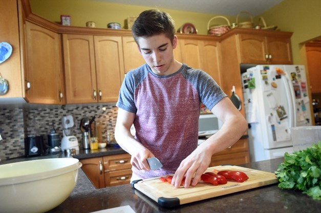 teenager cooking a meal