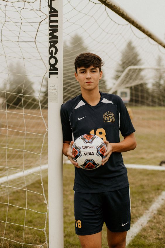 soccer senior picture pose