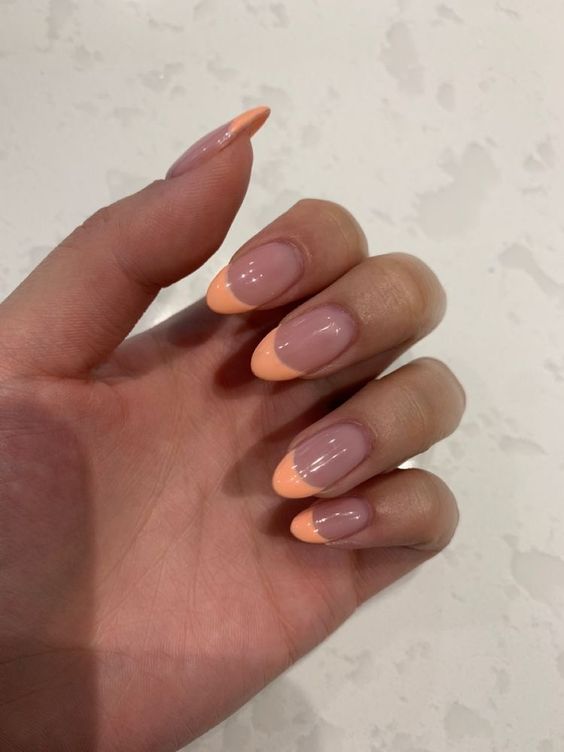 Teenage short orange nails 