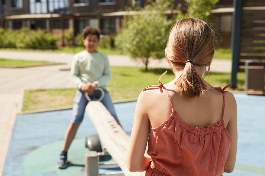 Using a seesaw at the park