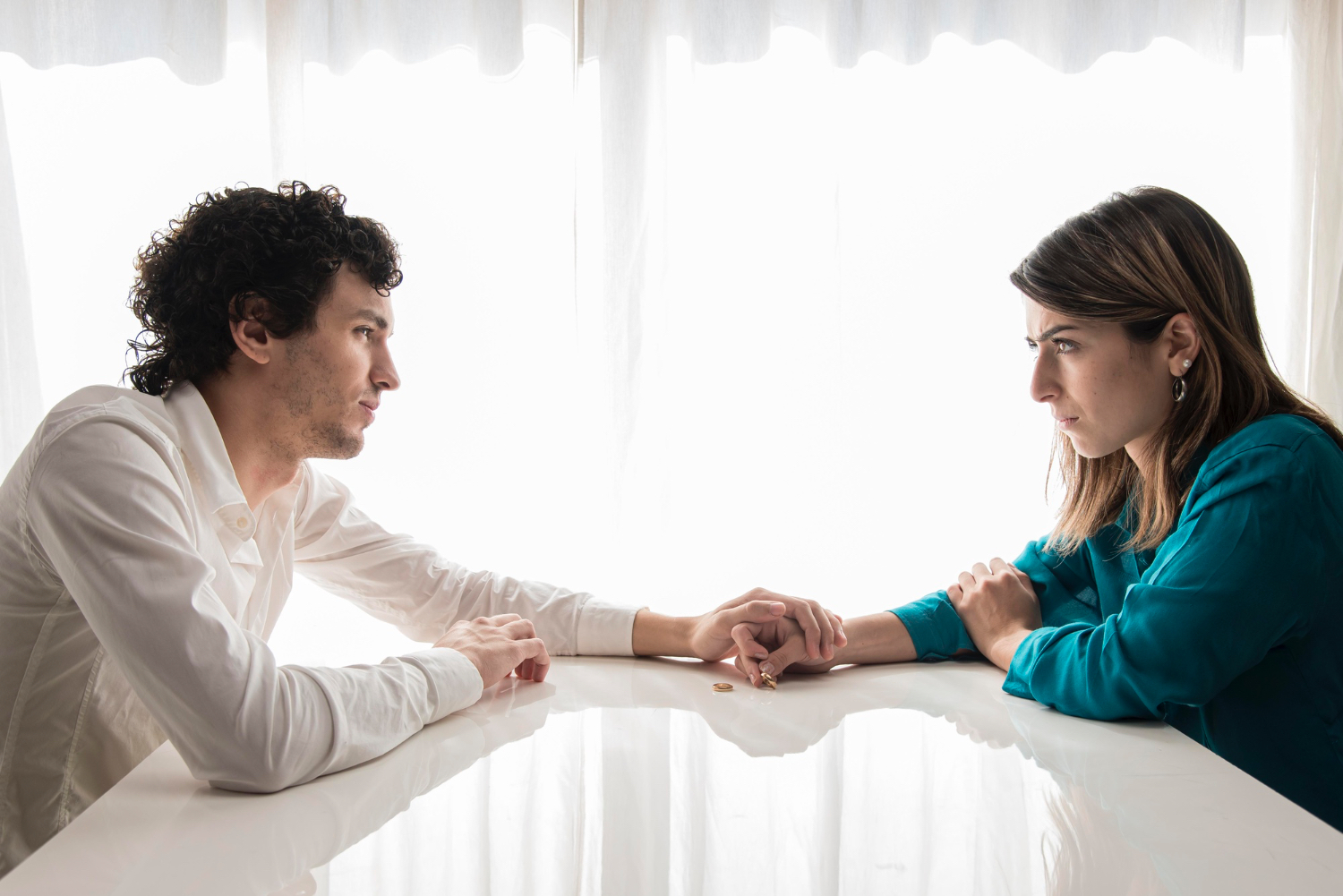 Couple calming down after argument holding hands
