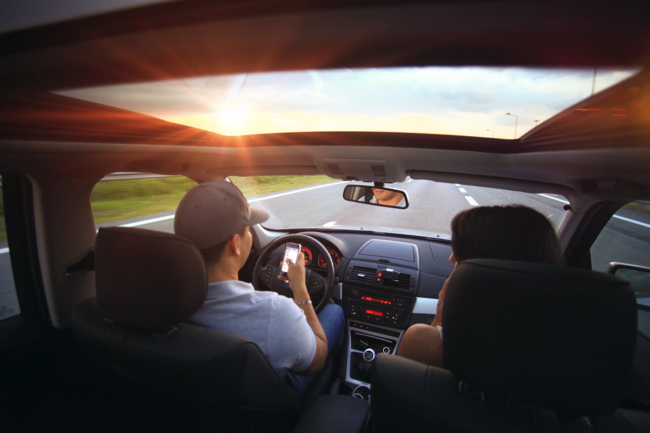 Texting or hand-held phone use at the wheel