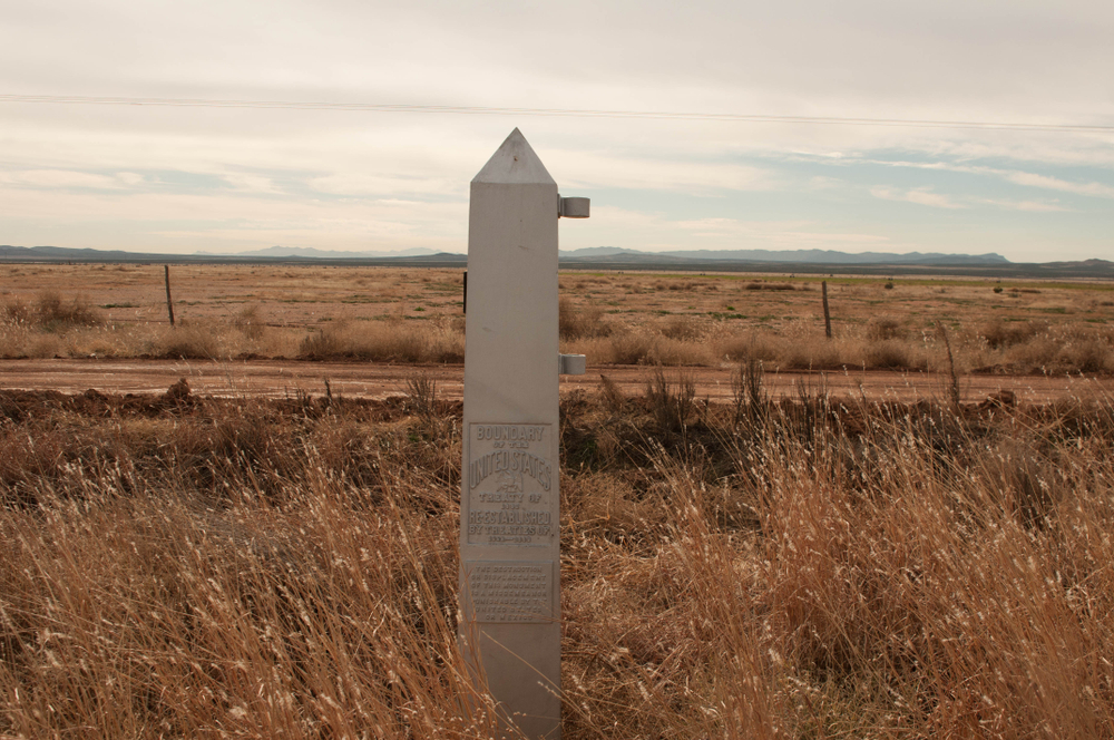 Columbus, New Mexico / USA / Dec. 7, 2019: A U.S.-Mexico border marker helps delineate the line between both countries.